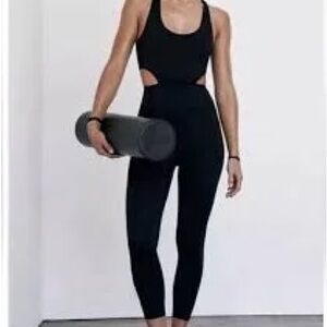 FP Movement by Free People Back It Up Onesie Black Cutout Jumpsuit small NWT
